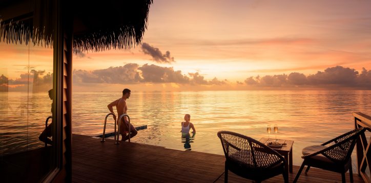 couple-overwater-sunset-pool-villa-2